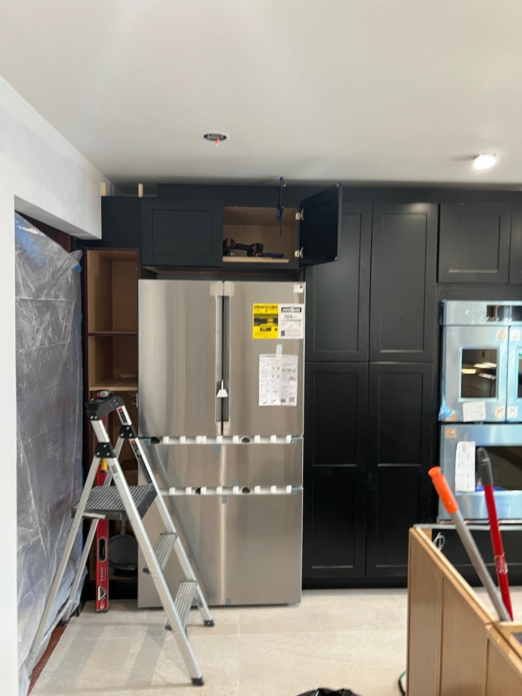 Black cabinets and appliances installation in progress Bergen County NJ Bergen Remodeling