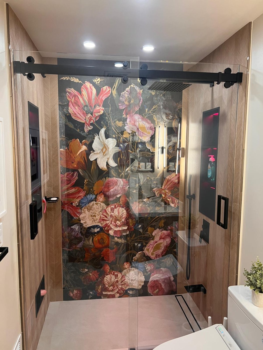Completed floral feature shower behind frameless glass Bergen County NJ Bergen Remodeling
