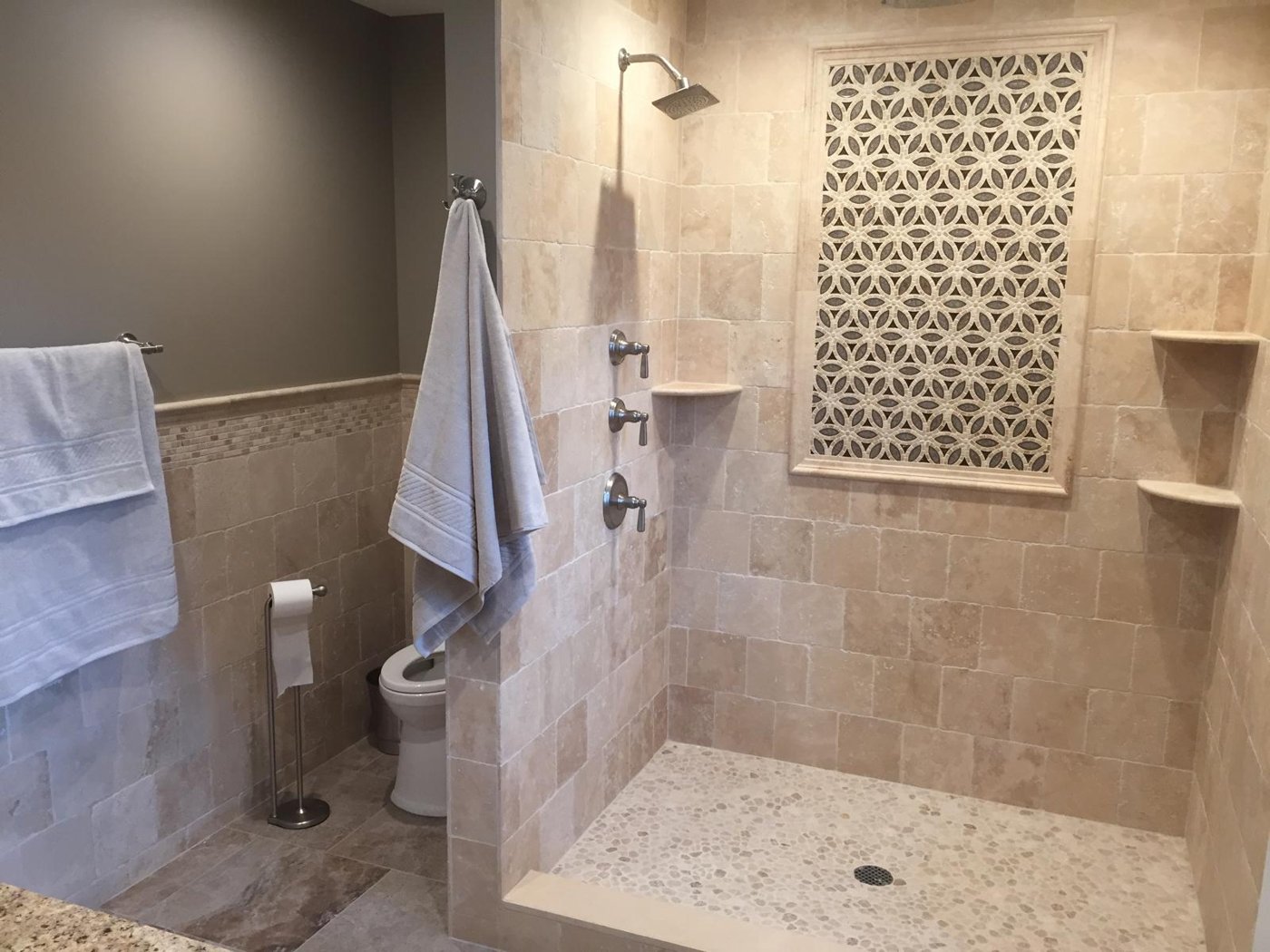 Completed travertine walk-in shower with mosaic accent Bergen County NJ Bergen Remodeling
