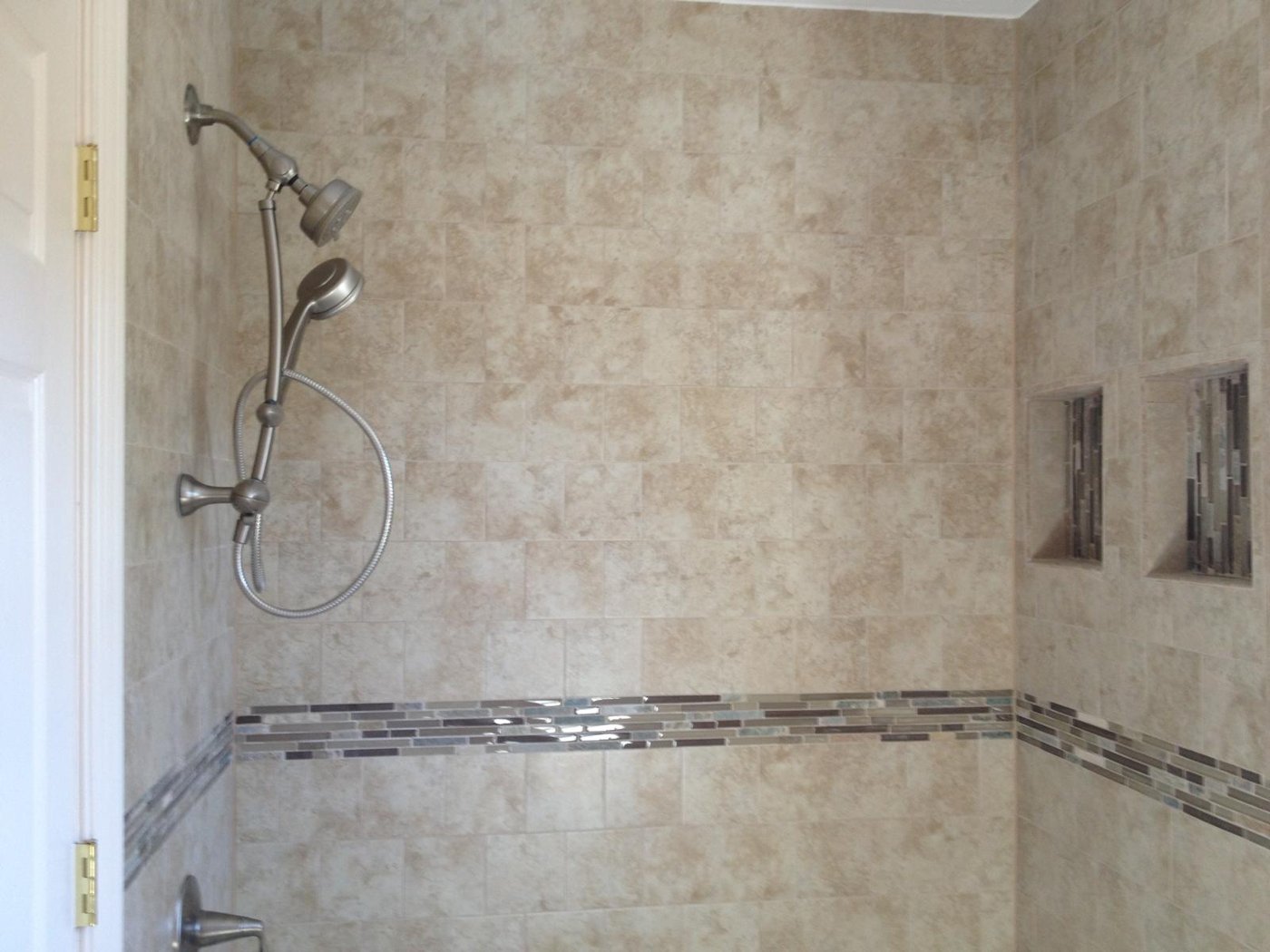 Travertine walk-in shower with glass tile band Bergen County NJ Bergen Remodeling